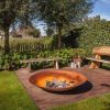 Steel fire bowl in a garden