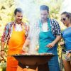 Friends cooking over a bbq