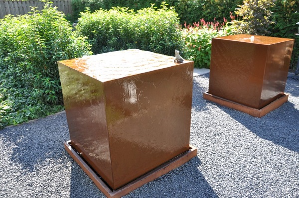 Corten Steel water tables in a garden