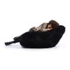 woman laying on black fur bean bag