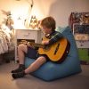 playing guitar on blue bean bag indoors