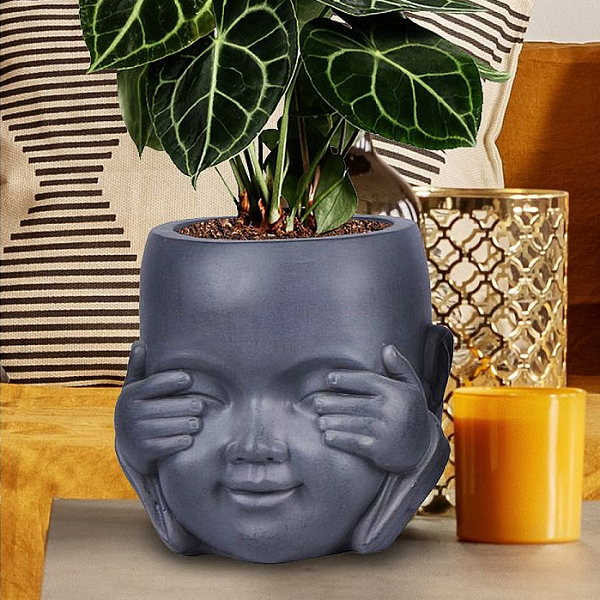 see no evil fibrestone indoor plant pot resting on table